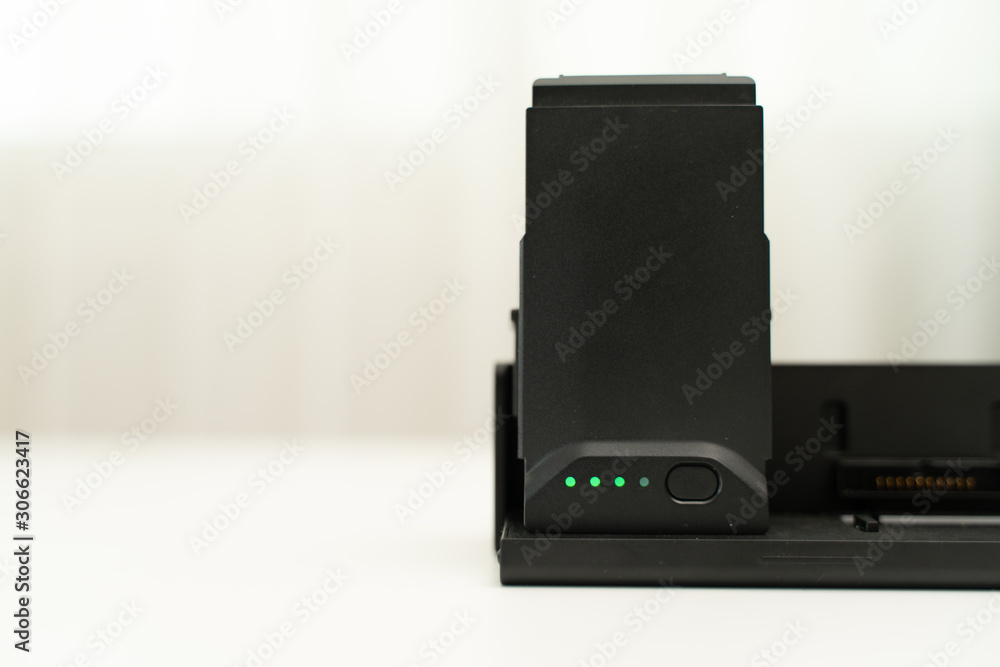 Charging modern quadcopter drone battery Charging modern quadcopter drone battery