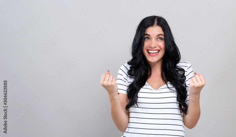 Successful young woman on a gray background Successful young woman on a gray background