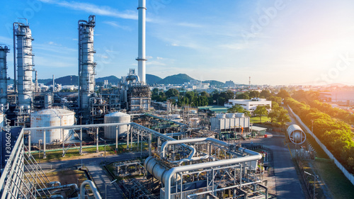 Aerial view of smart chemical oil refinery plant, power plant on blue sky background , Gas Oil depot, Crude Oil Refinery Plant Steel Pipe line and Chimney Cooling tower, Chemical or Petrochemical