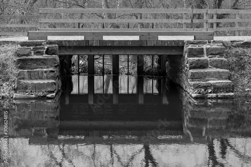canal bridge black & white, reflection in water