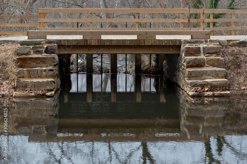 c&o canal bridge with water reflection