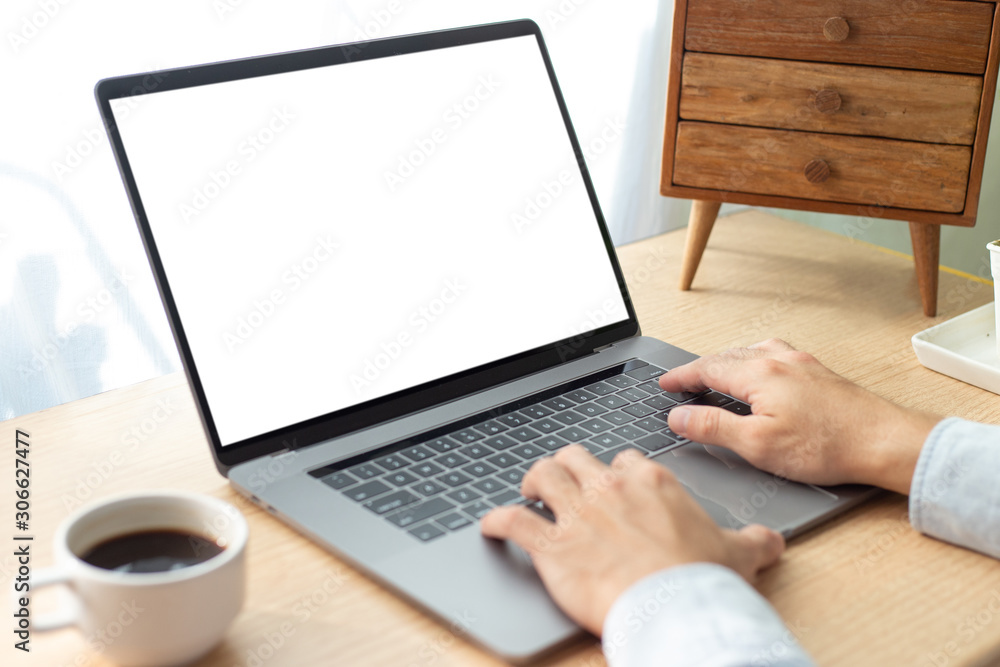 mockup image blank screen computer,cell phone with white background for advertising text,hand man using laptop texting mobile contact business search information on desk in office.marketing and design mockup image blank screen computer,cell phone with white background for advertising text,hand man using laptop texting mobile contact business search information on desk in office.marketing and design