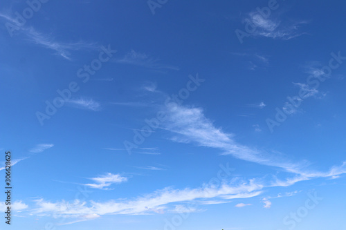 blue sky with white clouds © teekawat