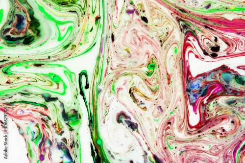 Modern painting in the technique of Ebru and suminagashi. Abstract drawings on water with acrylic paints.Marble liquid texture.