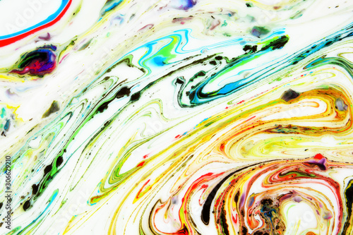 Modern painting in the technique of Ebru and suminagashi. Abstract drawings on water with acrylic paints.Marble liquid texture.