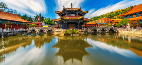 Panorama of Yuantong Temple refletion with waterfront, Kunming capital city of Yunnan, China, travel and tourism,famous place and landmark, religion and traditional concept photo