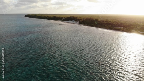 Eastern District East End beach in the Cayman Islands with board walj photo