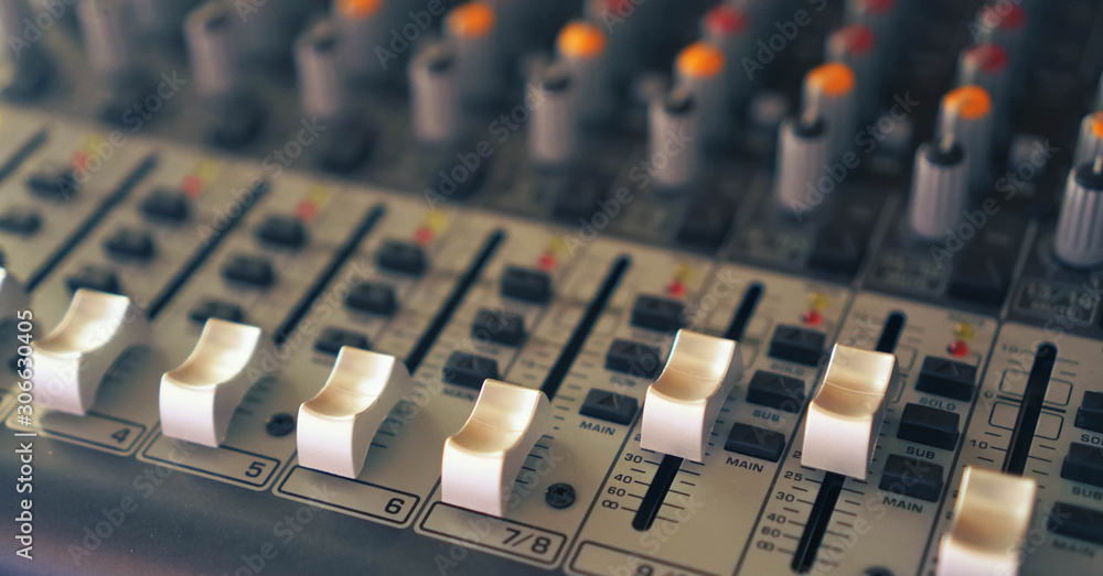 Fototapeta premium equipment for sound mixer control, audio mixer control panel with buttons and sliders.