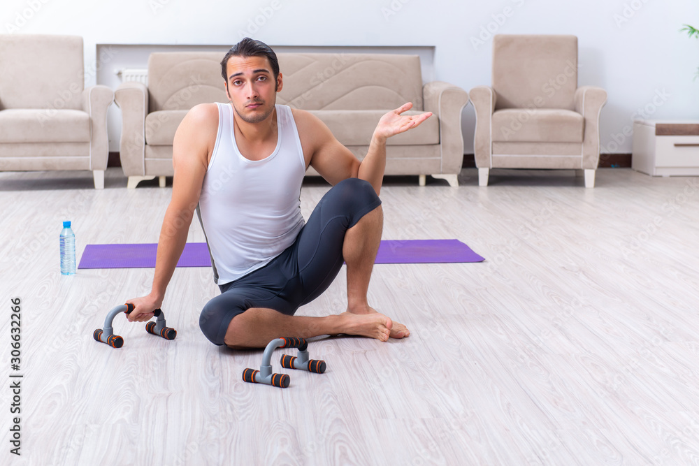 Young man training and exercising at home Young man training and exercising at home