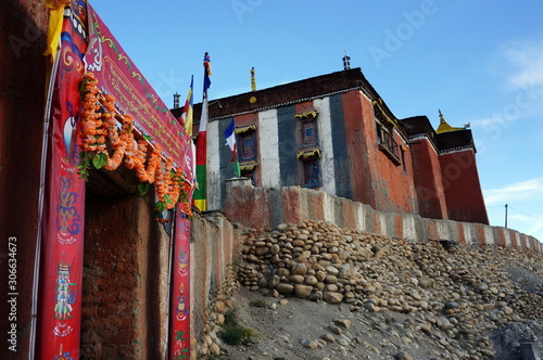 The gate with decoration at the entrance to Tsarang Gompa is a monastery of the Sakya sect, built in 1395. Trekking to the Upper Mustang closed area. Nepal.