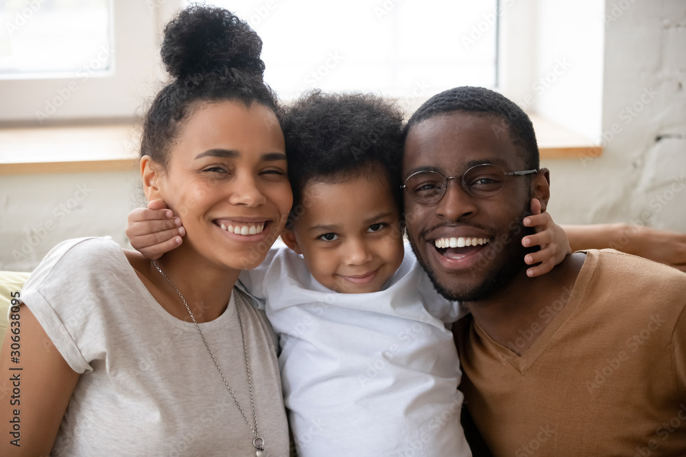 Portrait of happy young family posing with little son Portrait of happy young family posing with little son