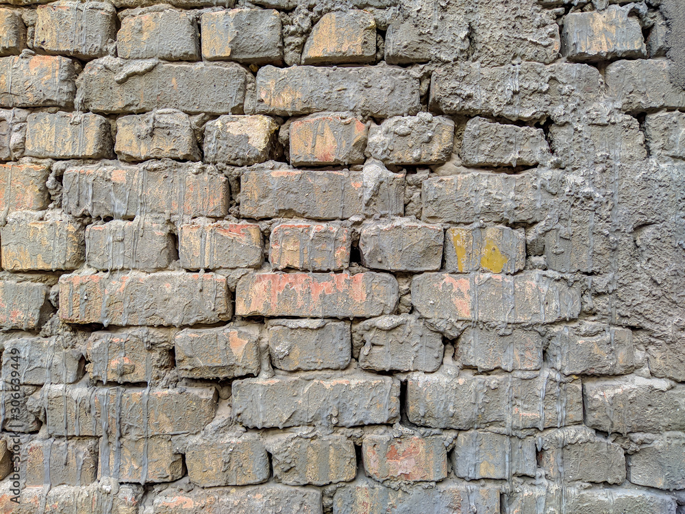 Old bricks texture. Bricks with cement background backdrop photo for design. Vintage wall with stone brick facade.