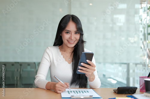 businesswoman using mobile phone. freelance woman using smartphone. business concept