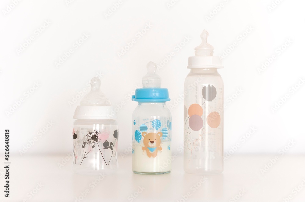 baby milk bottles isolated on white table. baby milk bottles isolated on white table.
