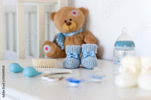 knitted baby shoes isolated on table.