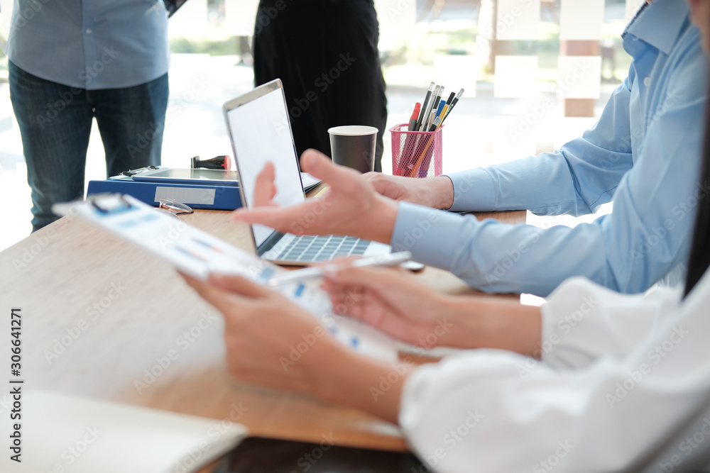 Fototapeta premium business people discussing on performance revenue in meeting. businessman working with businesswoman.