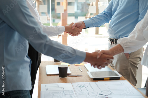 Wallpaper Mural businessman shaking hands after meeting. Business people handshaking. Greeting deal, teamwork partnership Torontodigital.ca