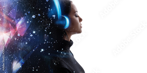 Portrait of woman in headphones listening music with closed eyes. Double exposure of female face and galaxy isolated on white background. Digital art. Blue neon light. Free space for text.