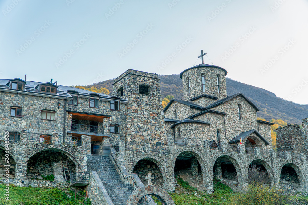 Russia, North Ossetia. Monastery in Fiagdon in the mountains in autumn