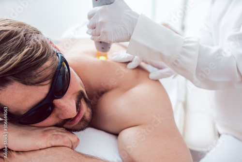 Man in a hair removal studio photo