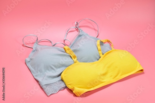 Gray and yellow underwear bras for women Put on a pink background
