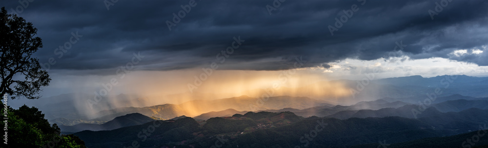 sunset sky with fog and rainy clouds raining over the Majestic mountains landscape sunset sky with fog and rainy clouds raining over the Majestic mountains landscape
