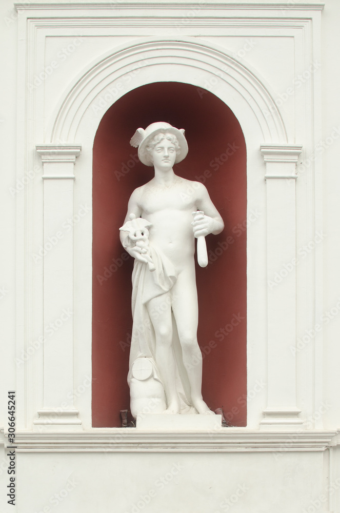 Hermes statue on the facade of the building
