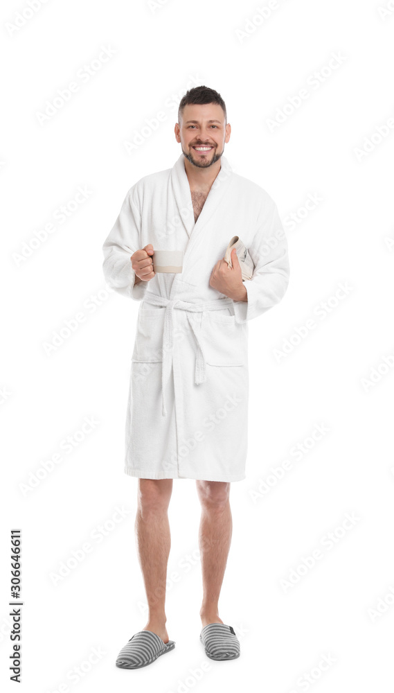 Handsome man with cup of coffee and newspaper wearing bathrobe on white background Handsome man with cup of coffee and newspaper wearing bathrobe on white background