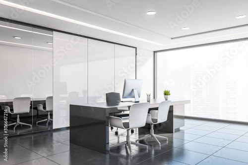 Corner of panoramic CEO office with white panel walls, gray tiled floor, grey computer table and meeting room in background. 3d rendering