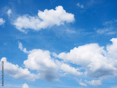 White clouds on a blue sky background