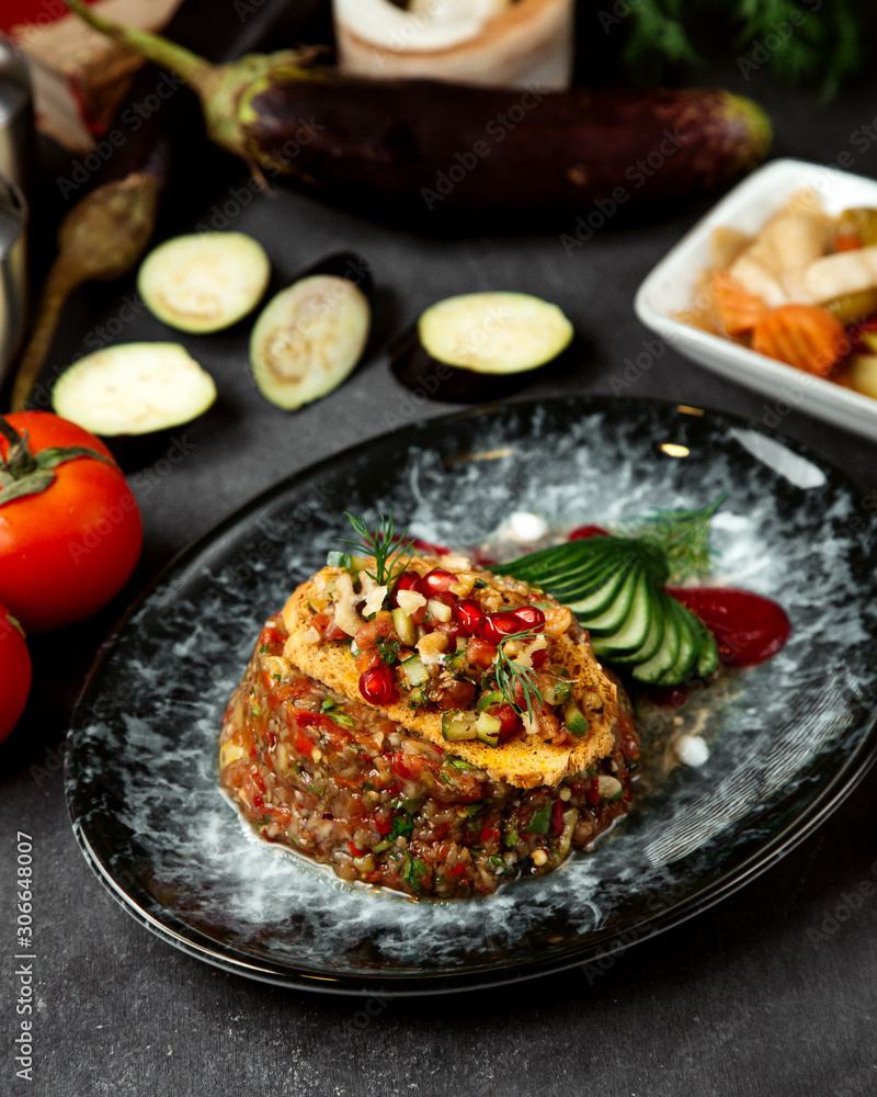 eggplant caviar topped with herbs and pomegranate eggplant caviar topped with herbs and pomegranate