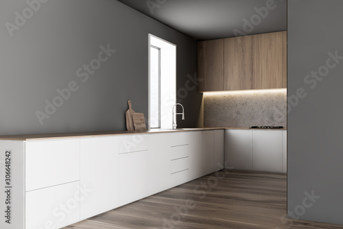 Gray kitchen corner with white countertops