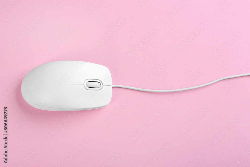 Modern wired optical mouse on pink background, top view Modern wired optical mouse on pink background, top view