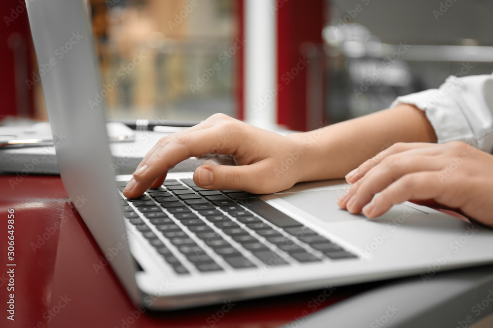 Blogger working with laptop in cafe, closeup Blogger working with laptop in cafe, closeup