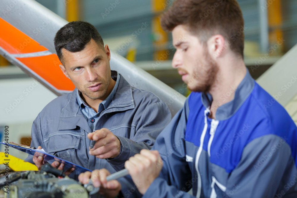 engineers maintenance airplane are performing repairs engineers maintenance airplane are performing repairs
