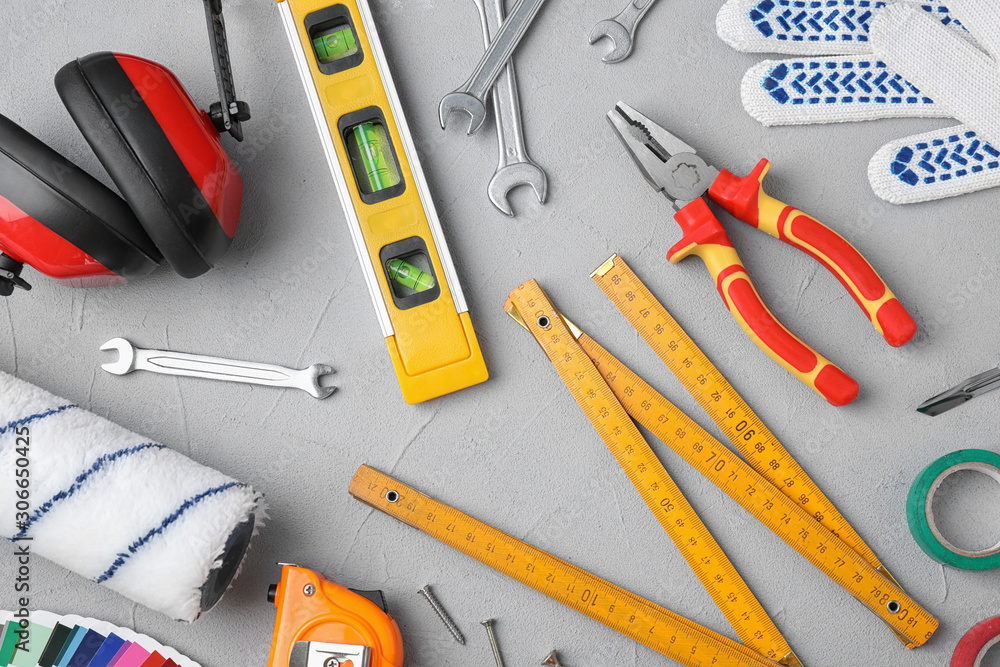 Flat lay composition with construction tools on light grey background Flat lay composition with construction tools on light grey background