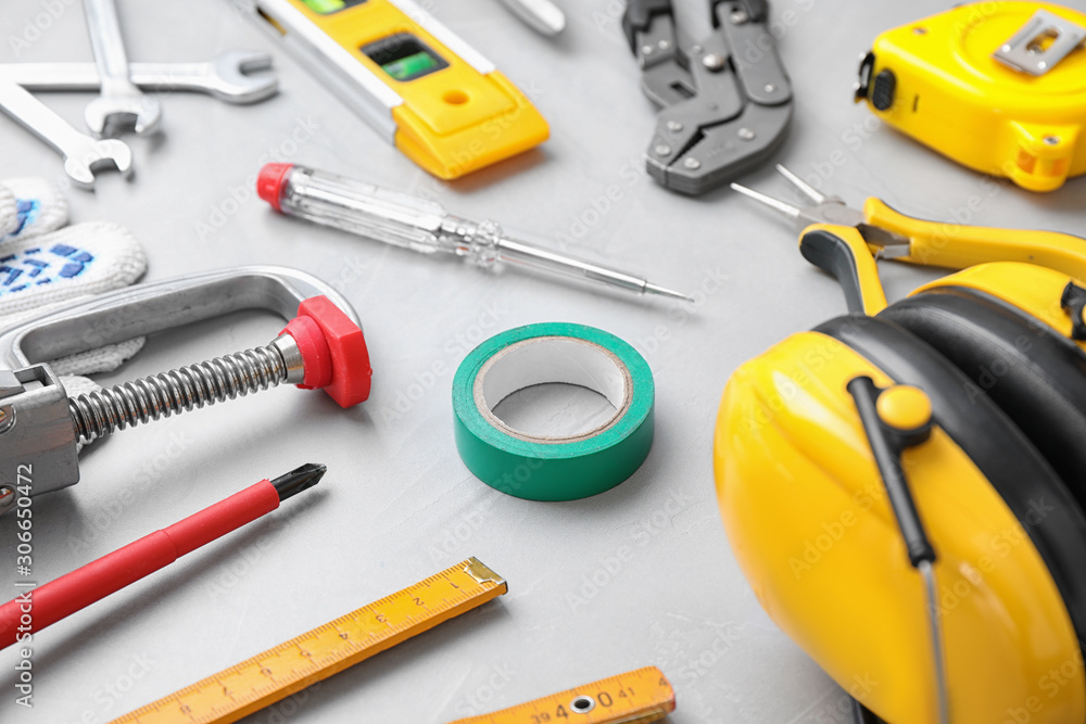 Different construction tools on light grey background Different construction tools on light grey background