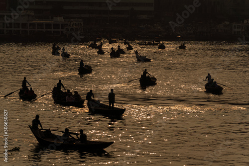 Silhouette of river boats at Sadar Ghat, Dhaka. photo