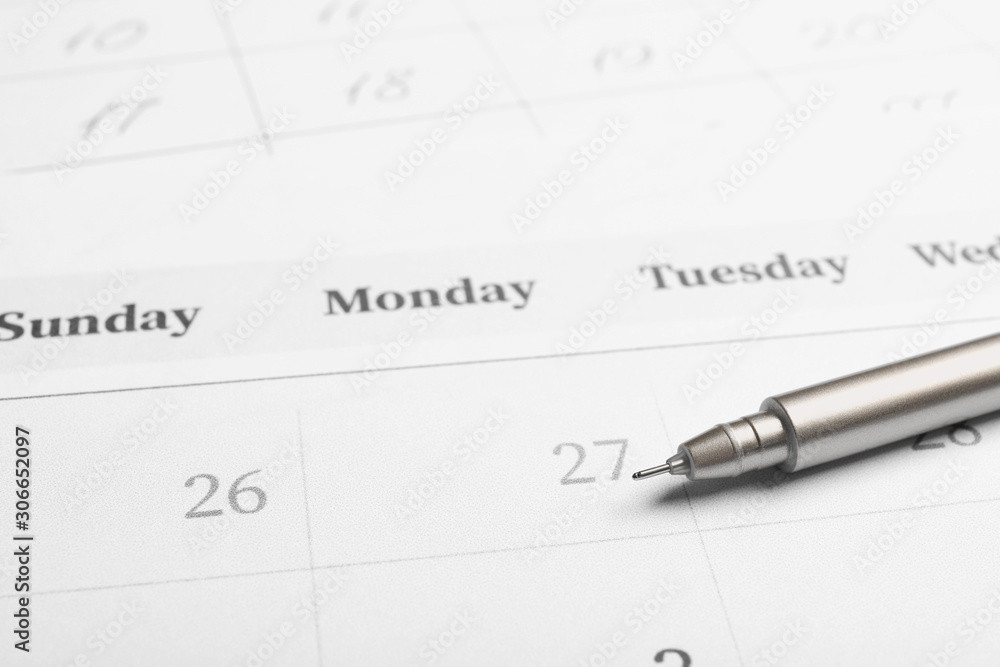 Pen on calendar page, closeup. Planning concept Pen on calendar page, closeup. Planning concept