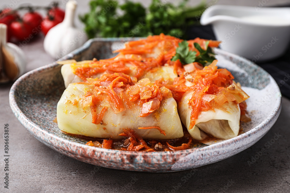 Delicious cabbage rolls served on grey table, closeup Delicious cabbage rolls served on grey table, closeup
