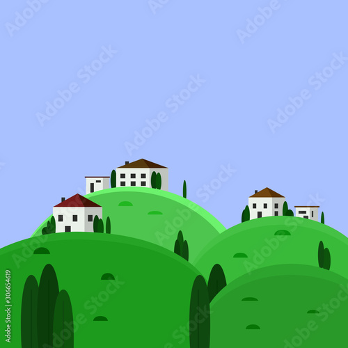 The village is on top of the hills. Small houses surrounded by trees. Rural landscape.
