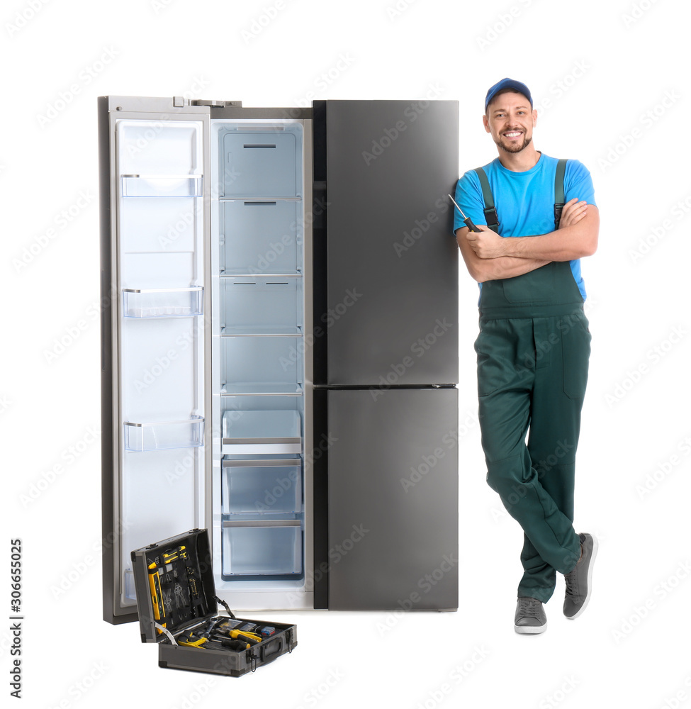 Male technician with tool box near refrigerator on white background Male technician with tool box near refrigerator on white background