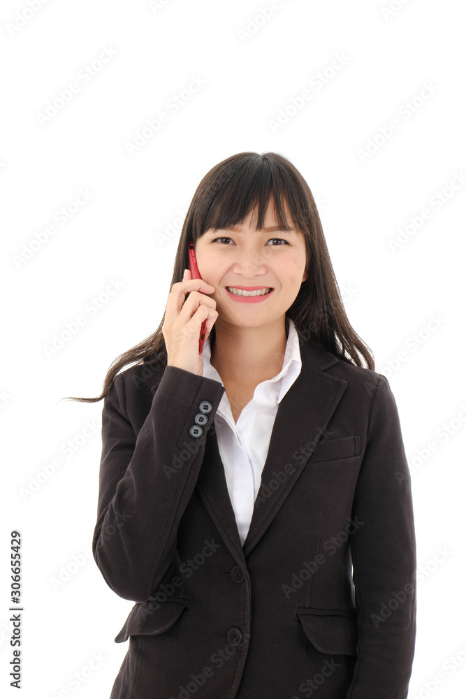Young asian business woman portrait in black suit with long hair standing and use a mobile phone and look at  camera on white background. studio isolated. Intelligent and confident people