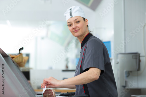 Canvas Print female shopkeeper in a grocery store