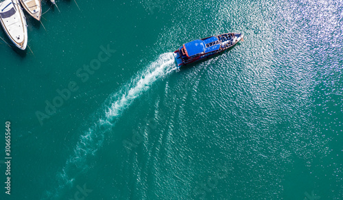 Pleasure white yacht coral reef in blue transparent turquoise water sea. Aerial top view.