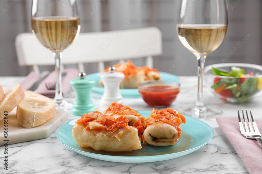 Delicious cabbage rolls served on white marble table indoors. Space for text Delicious cabbage rolls served on white marble table indoors. Space for text