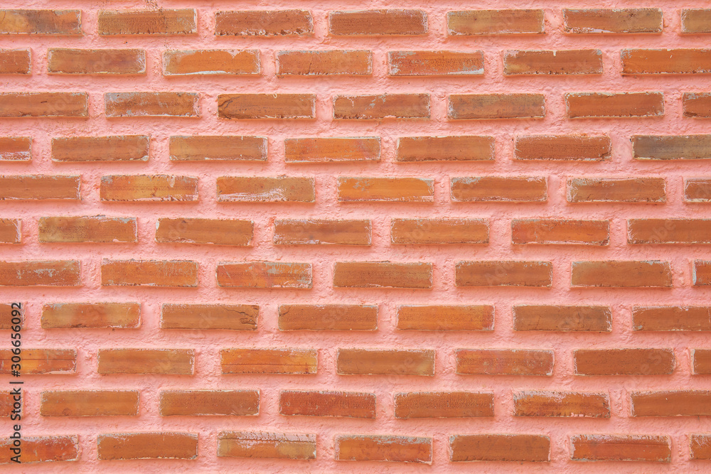 Obraz premium Red stone brick wall for background or backdrop.