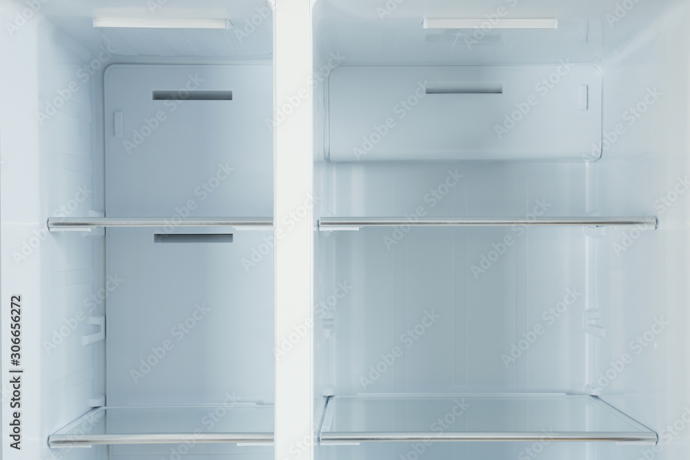 Fototapeta premium Shelves of empty modern refrigerator, closeup view
