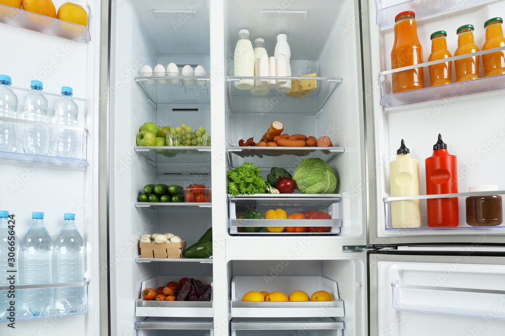 Open refrigerator full of different fresh products Open refrigerator full of different fresh products