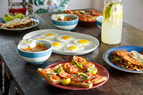 simple healthy food on an old wooden table, serving with simple dishes, natural lemonade.